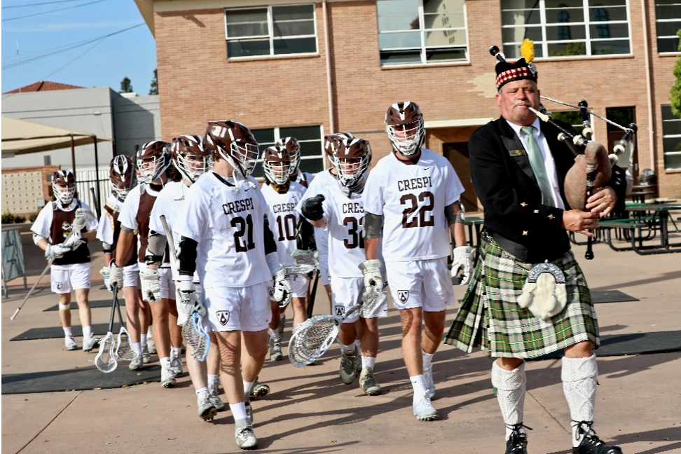 Lacrosse Team Marches With Bagpiper Harry