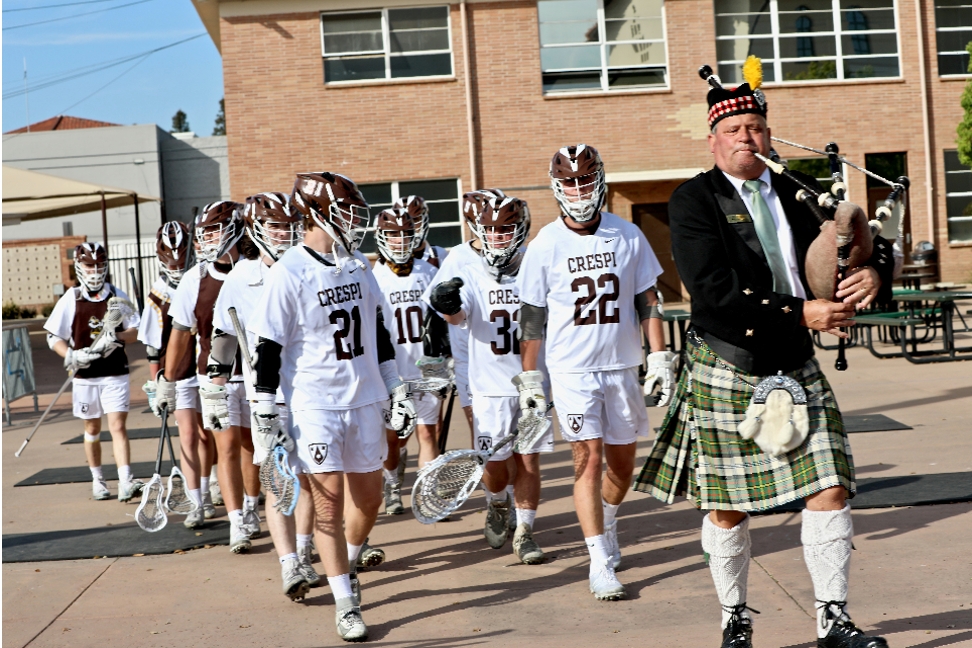 Harry with Crespi High Lacrosse Lacrosse Team Marches With Bagpiper Harry